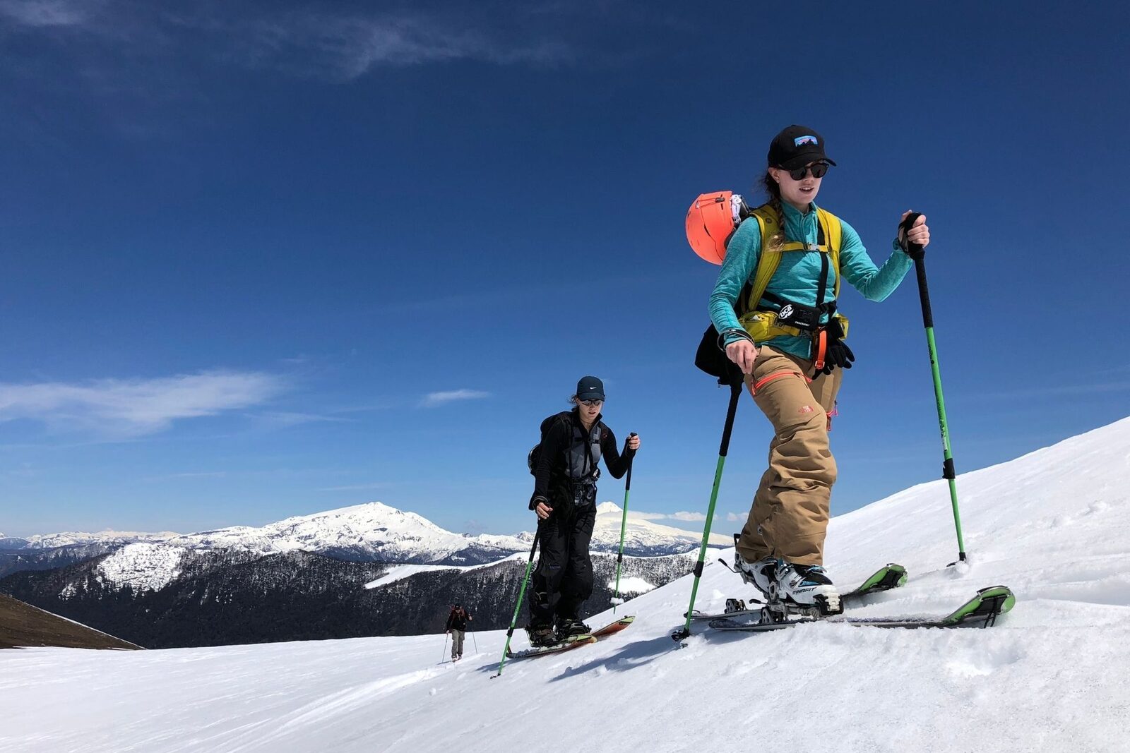 Ski tourers climbing a snowy slope